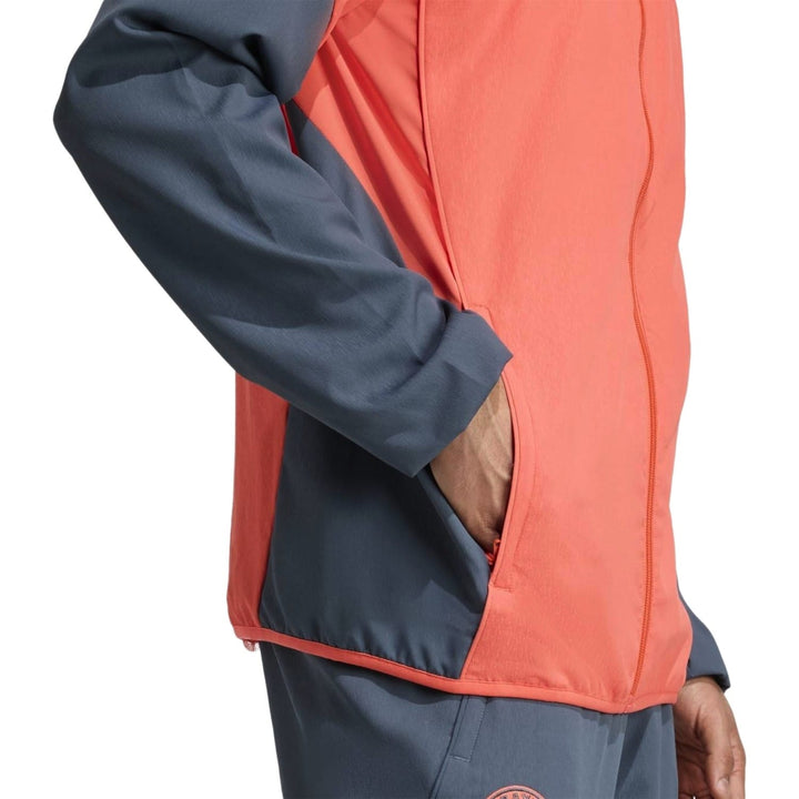 Bayern Munich presentation tracksuit 2025 in vibrant orange and gray with zipper pockets and stylish fit