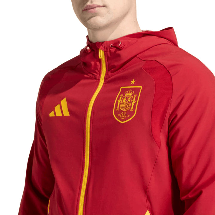 Spain Casual Travel hooded presentation soccer tracksuit 2026/27 in red with yellow accents by Soccer Tracksuits