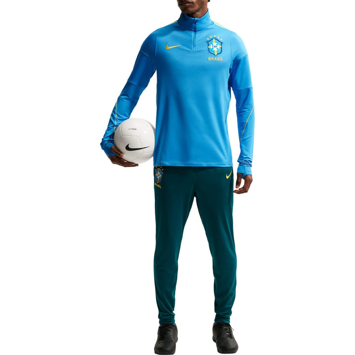 Men's blue Nike x Brazil training top with half-zip and green training pants featuring Brazil logo