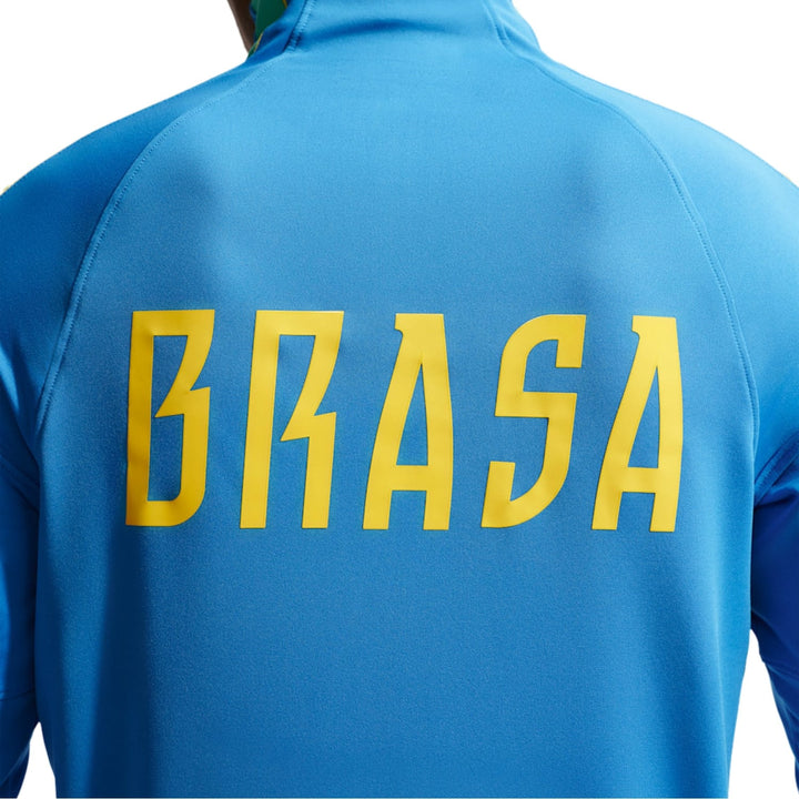 Blue Nike x Brazil athletic training top with yellow lettering, featuring the word 'BRASA' on the back.
