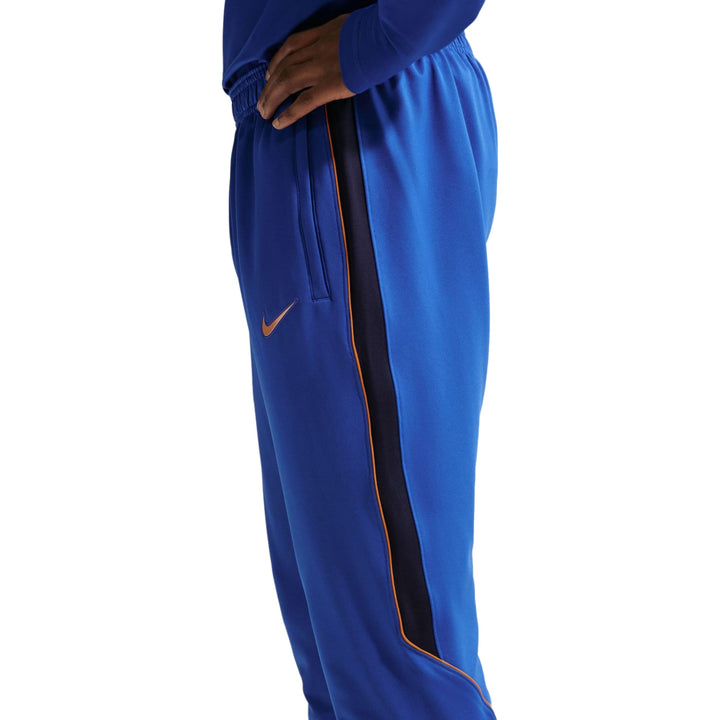 Blue Nike soccer tracksuit set with contrasting side stripes for adults, available in multiple sizes.