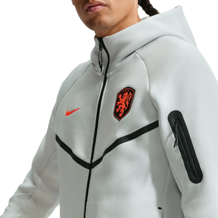 Nike Netherlands Tech Fleece 2026/27 presentation soccer tracksuit in grey with black and orange accents for adults