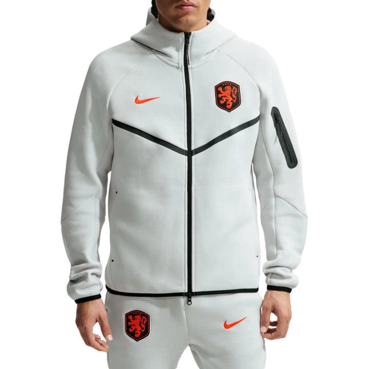 Nike Netherlands Tech Fleece presentation soccer tracksuit in white with orange accents and official logos