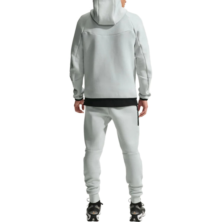 Light grey Nike Netherlands Tech Fleece presentation soccer tracksuit 2026/27 for adults with zip pockets