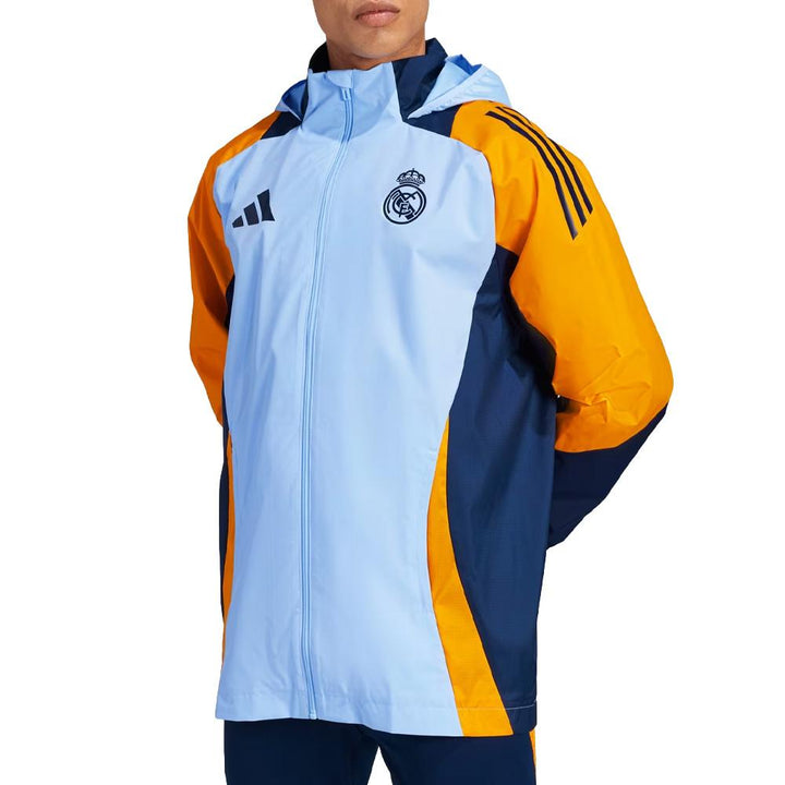 Colorful rain jacket with Adidas and Real Madrid logos on a white background