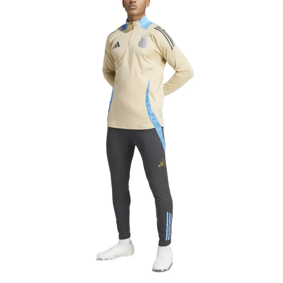 2024 Argentina technical tracksuit Adidas in beige and dark grey with blue accents modeled by male athlete