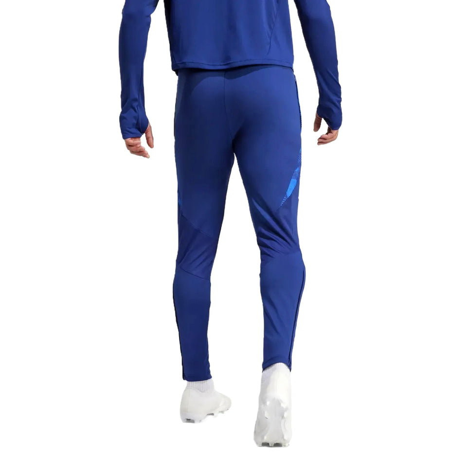 Back view of 2024 Italy Adidas tracksuit set in blue worn with white cleats