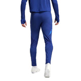 Back view of 2024 Italy Adidas tracksuit set in blue worn with white cleats