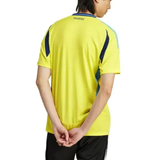 Back view of model wearing bright yellow Adidas Sweden soccer jersey 2024 25 with navy side panels and black shorts