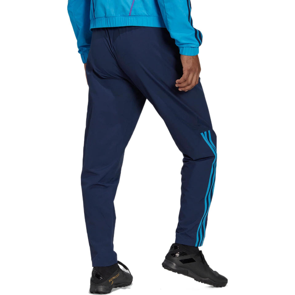 Rear view navy tracksuit pants with aqua side stripes and elastic cuffs Argentina presentation tracksuit 2022