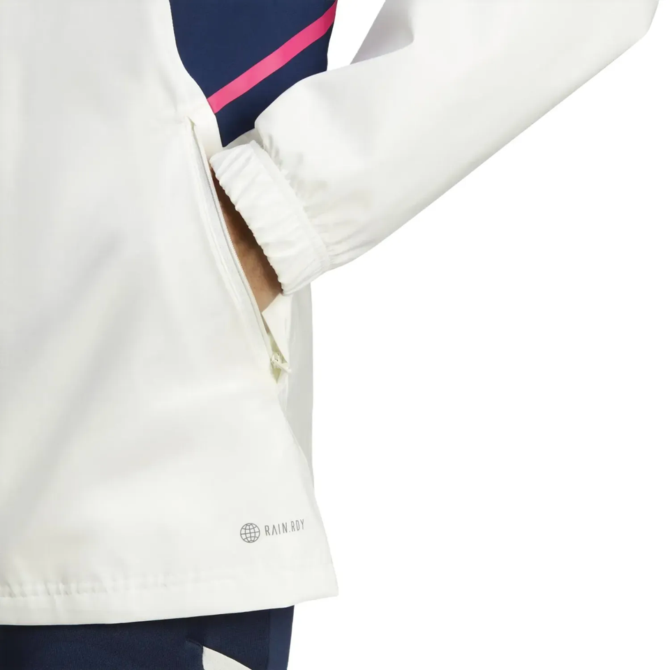Close-up of white Adidas Arsenal windbreaker 2023 sleeve and zippered pocket detail