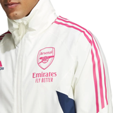 Close-up of Adidas Arsenal windbreaker 2023 in white with pink stripes and Arsenal logo on chest