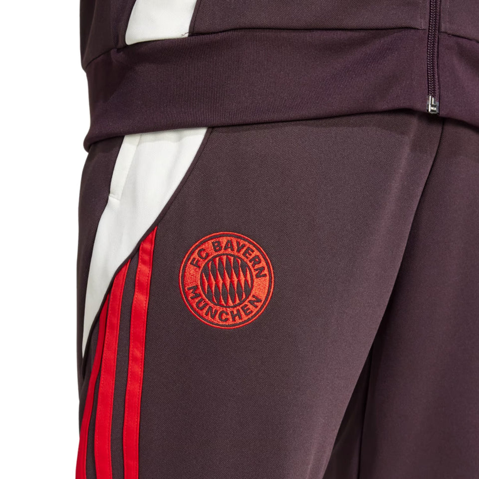 Close-up of Adidas Bayern Munich 2024 soccer tracksuit pants with red stripes and club logo