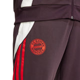 Close-up of Adidas Bayern Munich 2024 soccer tracksuit pants with red stripes and club logo