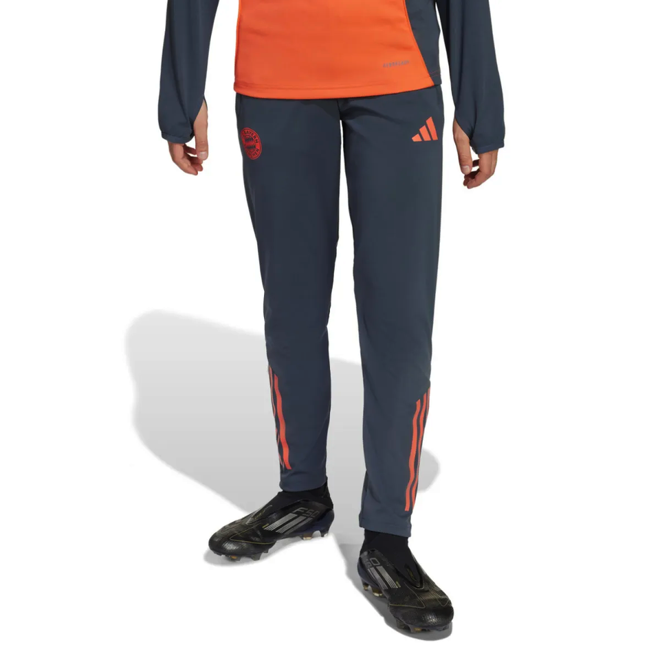 Adidas Bayern Munich training set for kids featuring a dark blue top and matching pants on SoccerTracksuits.com