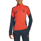 Adidas Bayern Munich training set for kids in vibrant red and navy with logo details on SoccerTracksuits.com