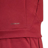 Close-up of red Adidas Belgium hooded tracksuit showing Aeroready fabric detail and ribbed cuffs