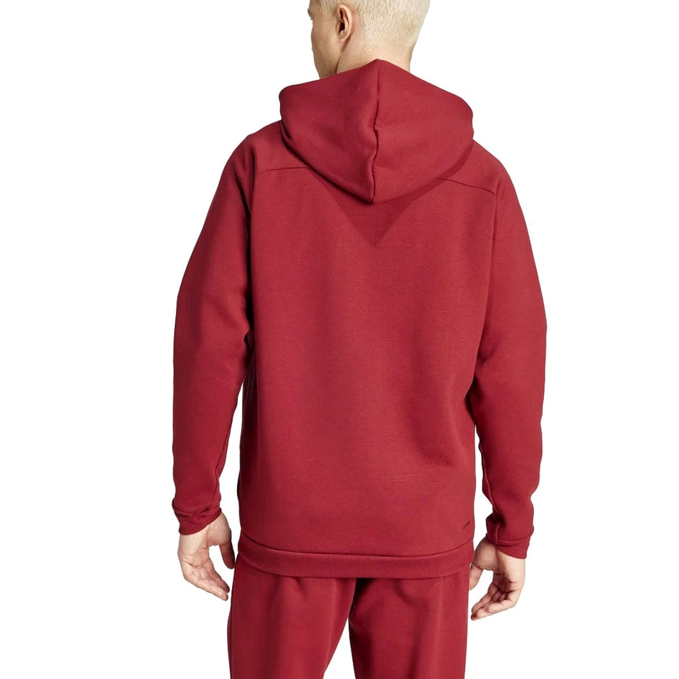 Back view of a red Adidas Belgium hooded tracksuit worn by a model showing the hood and relaxed fit