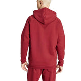 Back view of a red Adidas Belgium hooded tracksuit worn by a model showing the hood and relaxed fit