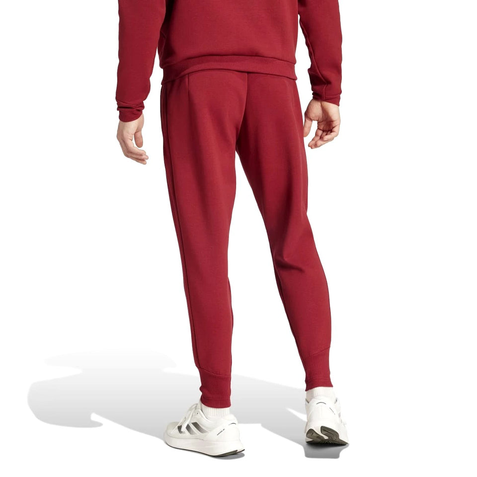 Back view of Adidas Belgium hooded tracksuit maroon pants worn with white sneakers