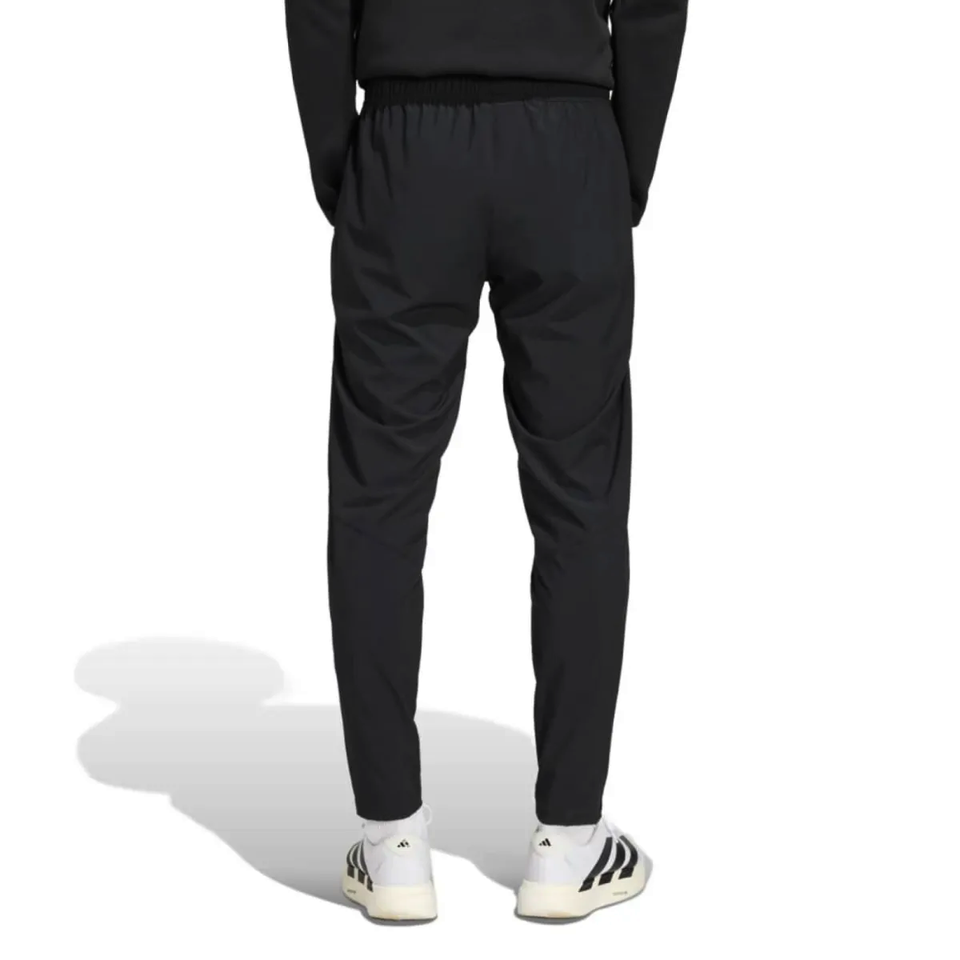 Back view of Adidas black Germany presentation suit 2026 with tapered pants and elastic waistband