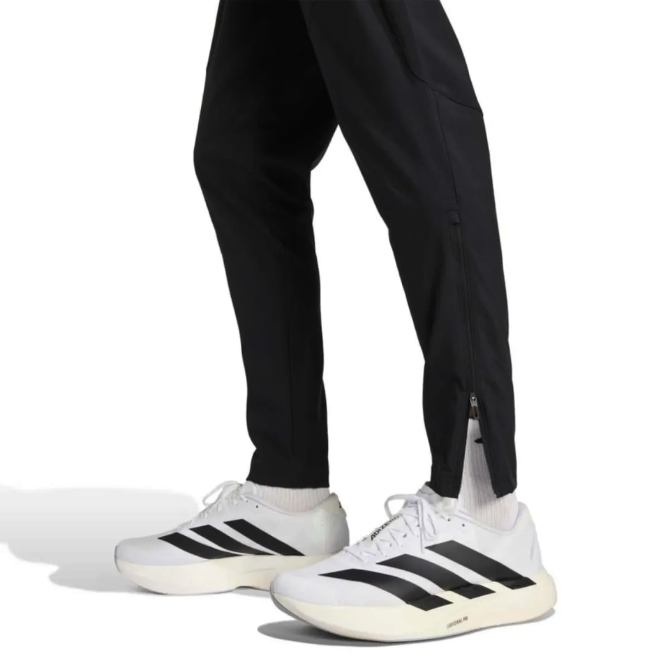 Adidas black Germany presentation suit 2026 featuring stylish tracksuit pants with zippered cuffs