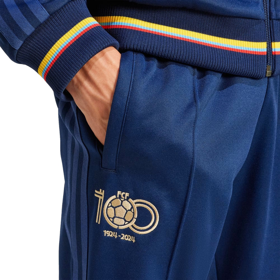 Adidas Colombia 100th anniversary tracksuit featuring navy color with vibrant detailing and anniversary logo