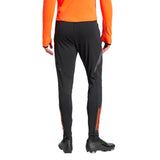Back view of Adidas Colombia training suit black pants with orange stripes for soccer practice