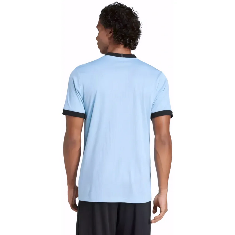 Back view of light blue goalkeeper jersey with black trim on male model Germany 175th anniversary goalkeeper jersey