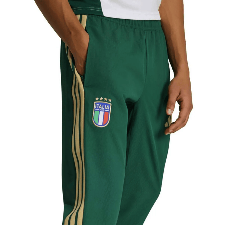 Green Adidas soccer tracksuit set featuring Italy logo and gold stripes on pants for adults in various sizes