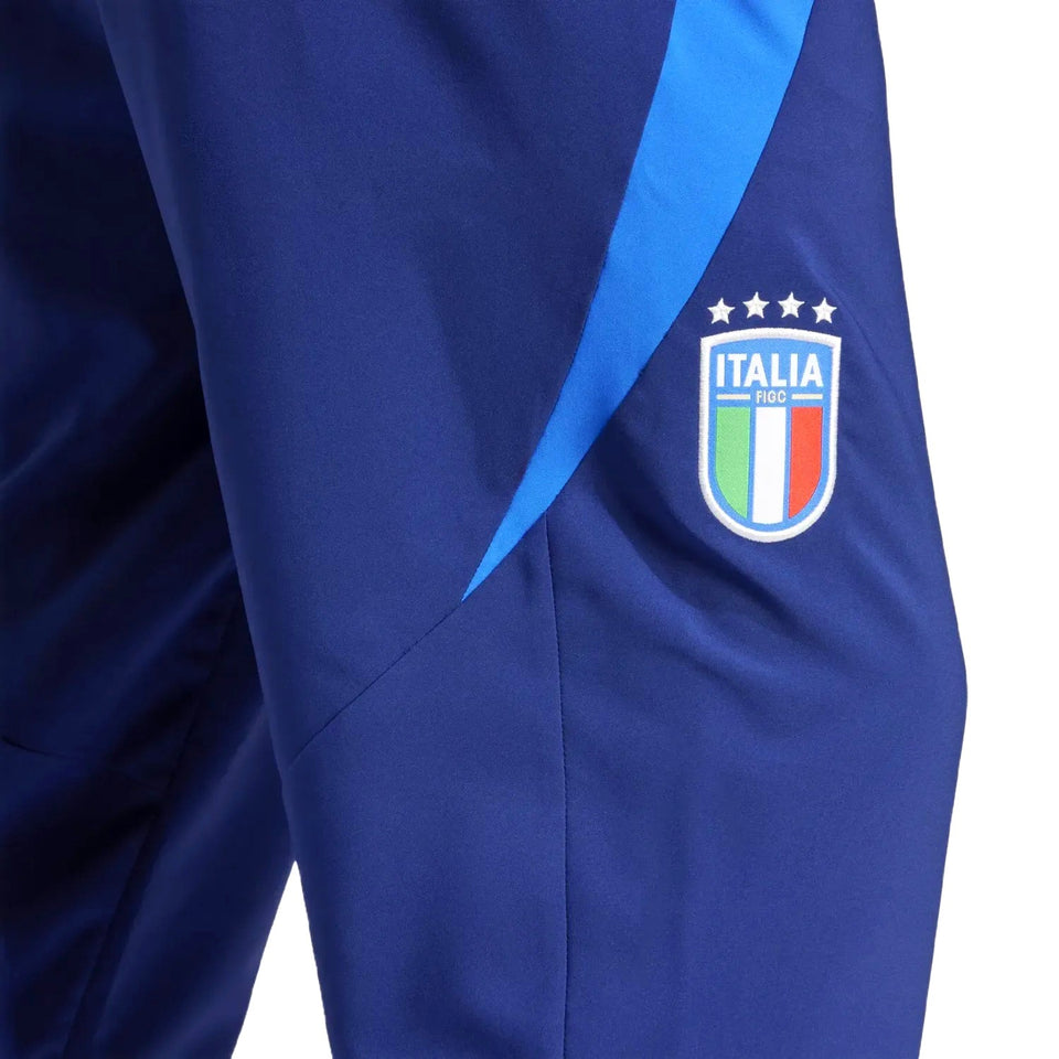 Close up of navy pants with light blue side stripe and Italia badge on Italy national team presentation tracksuit