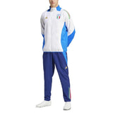 Italy national team presentation tracksuit white and blue zip jacket with crest and navy track pants on male model