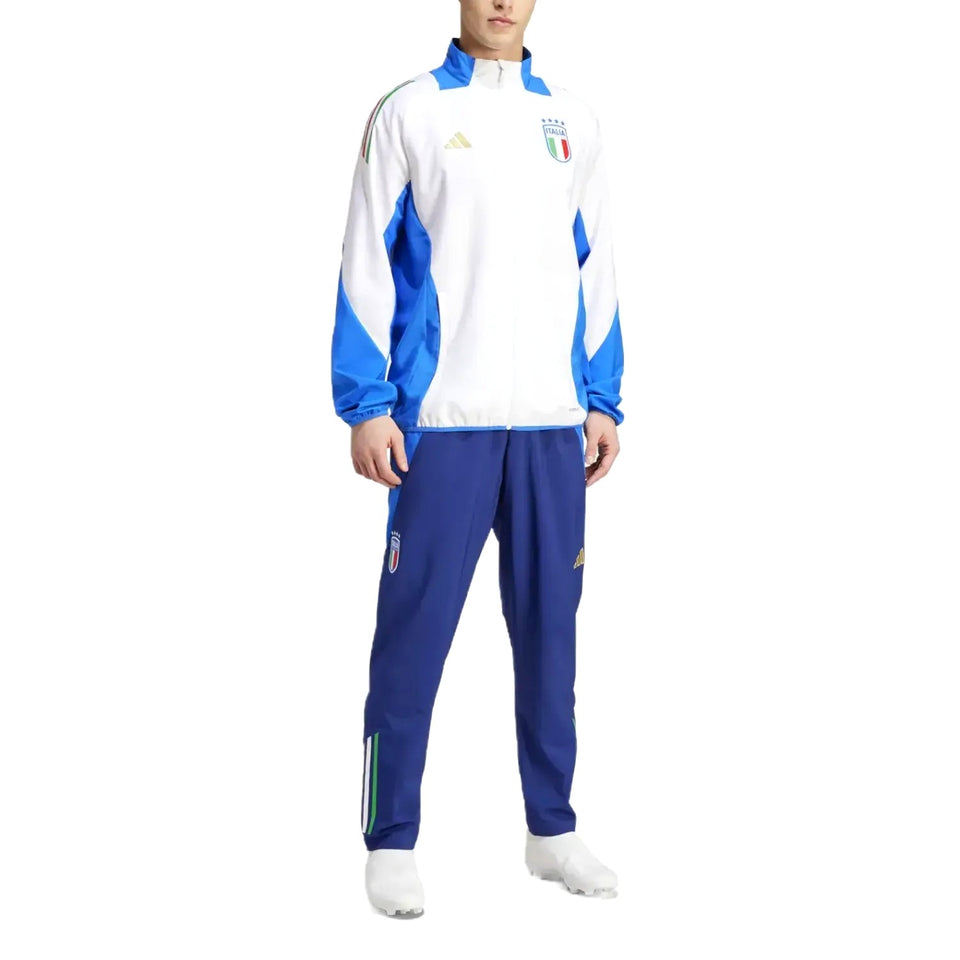 Man wearing Italy national team presentation tracksuit white and blue zip jacket with crest and blue pants
