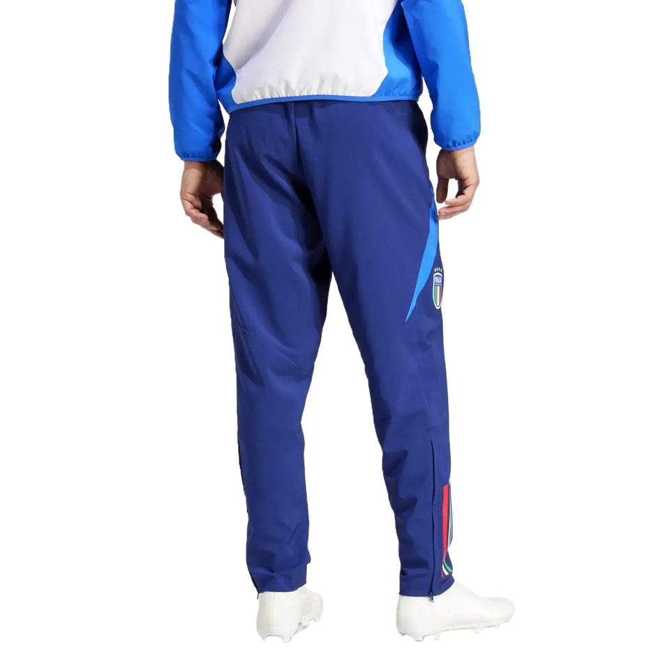 Back view of blue tracksuit pants and jacket with crest and tricolor stripe Italy national team presentation tracksuit
