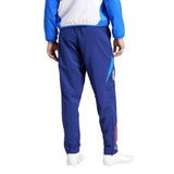 Back view of blue tracksuit pants and jacket with crest and tricolor stripe Italy national team presentation tracksuit