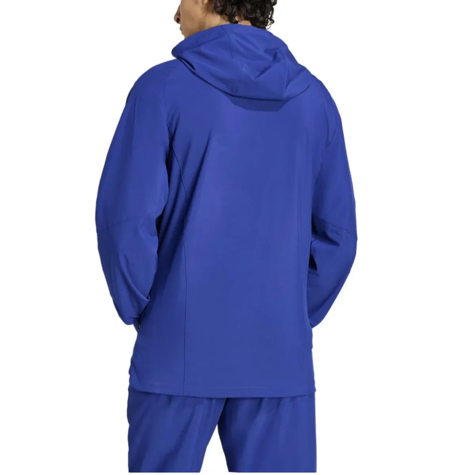 Back view of the Adidas Italy woven tracksuit 2026 in blue, perfect for athletic wear and training