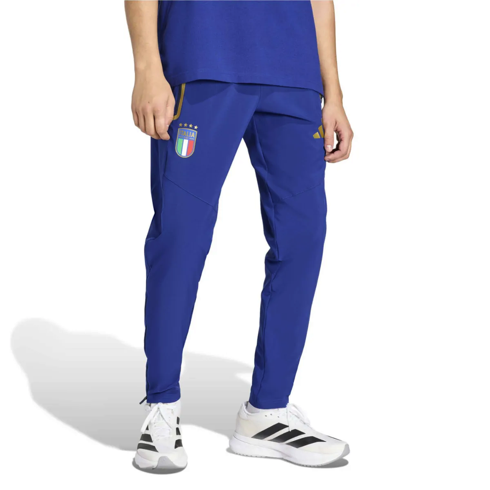 Adidas Italy woven tracksuit 2026 featuring blue pants with Italy badge and yellow accents