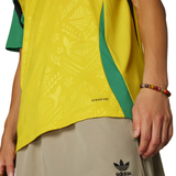 Jamaica 2024 Adidas soccer jersey featuring vibrant yellow and green colors, designed for fans and players