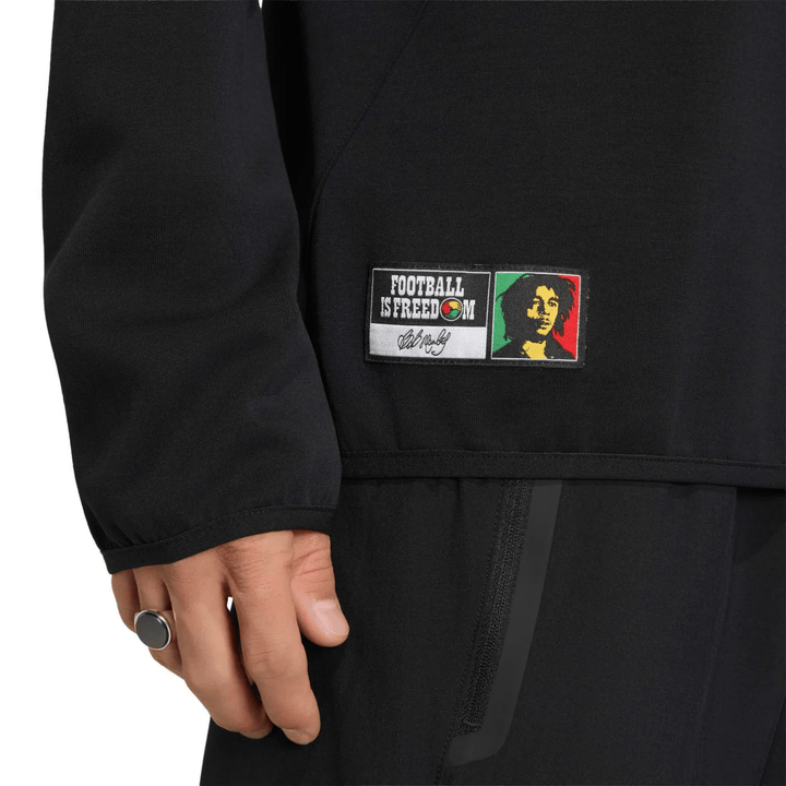 Black athletic sweatshirt with Bob Marley patch and "Football is Freedom" text