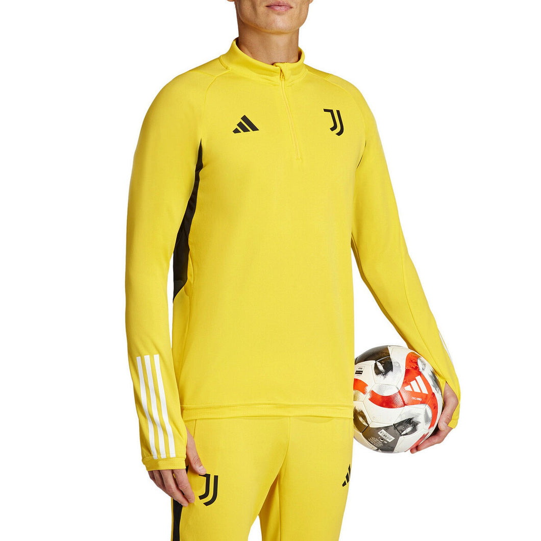 Juventus yellow training tracksuit 2024 with black accents and Adidas logo, worn by a person holding a soccer ball