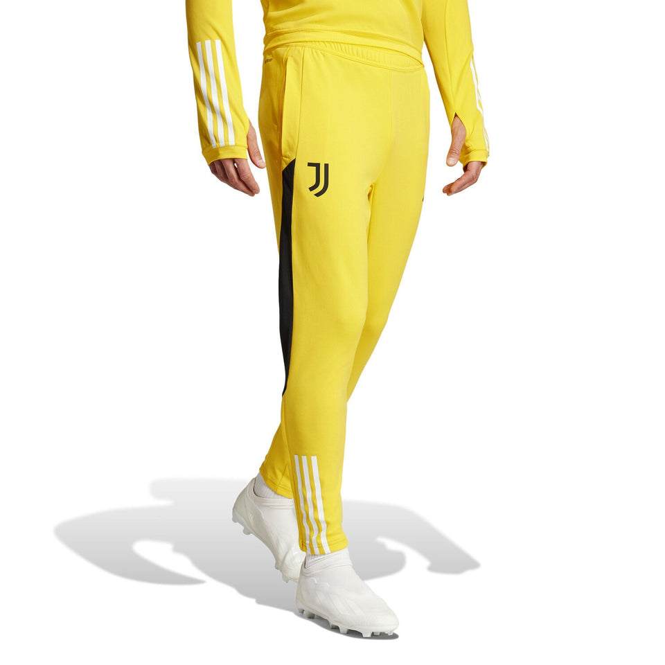 Juventus yellow training tracksuit 2024 pants with black side stripes and white logo on leg