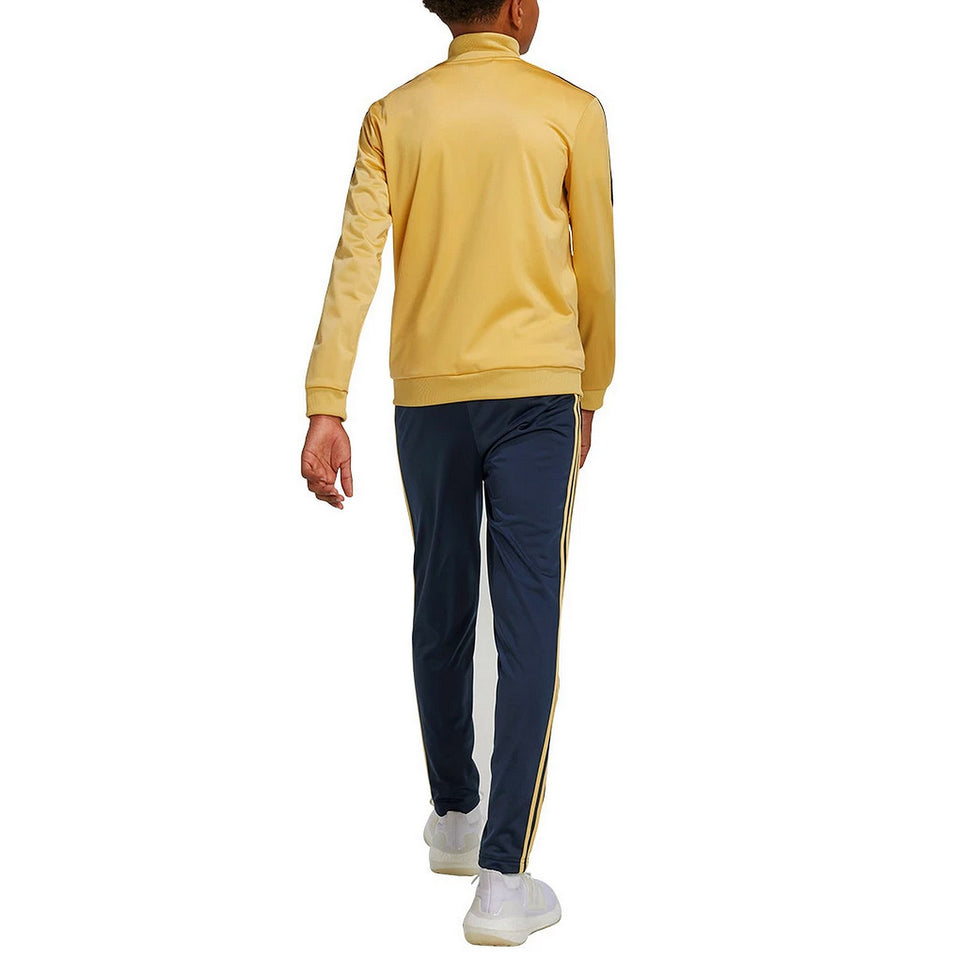 Back view of a child wearing a kids Juventus tracksuit 2024 with gold jacket and navy pants