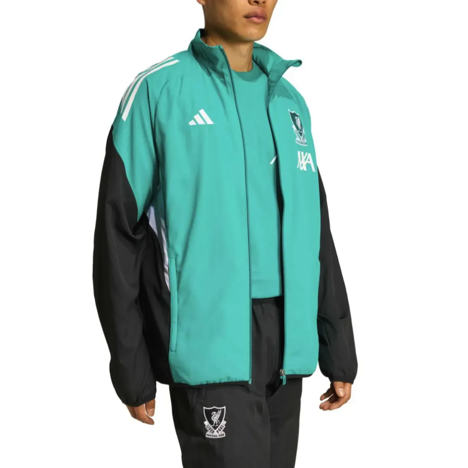Liverpool Champions League tracksuit featuring a teal jacket with black accents, ideal for soccer fans
