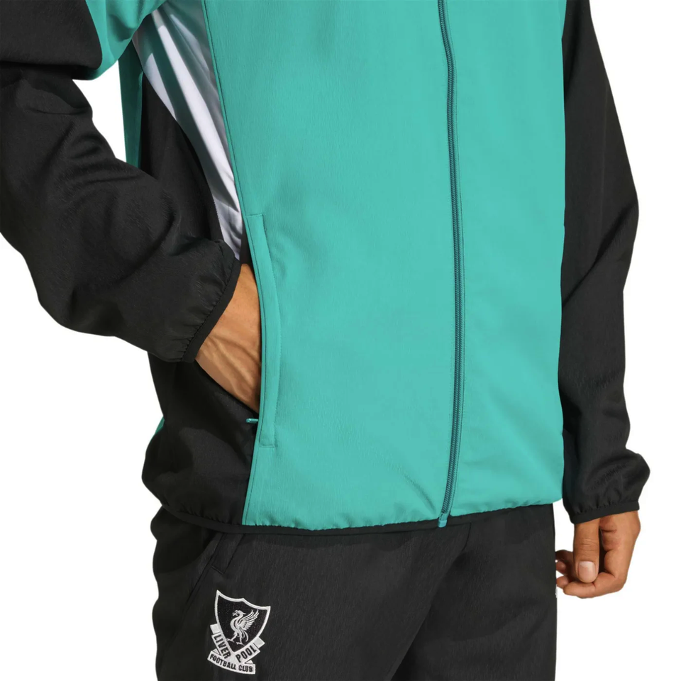 Liverpool Champions League tracksuit featuring a teal jacket and black pants with team logo