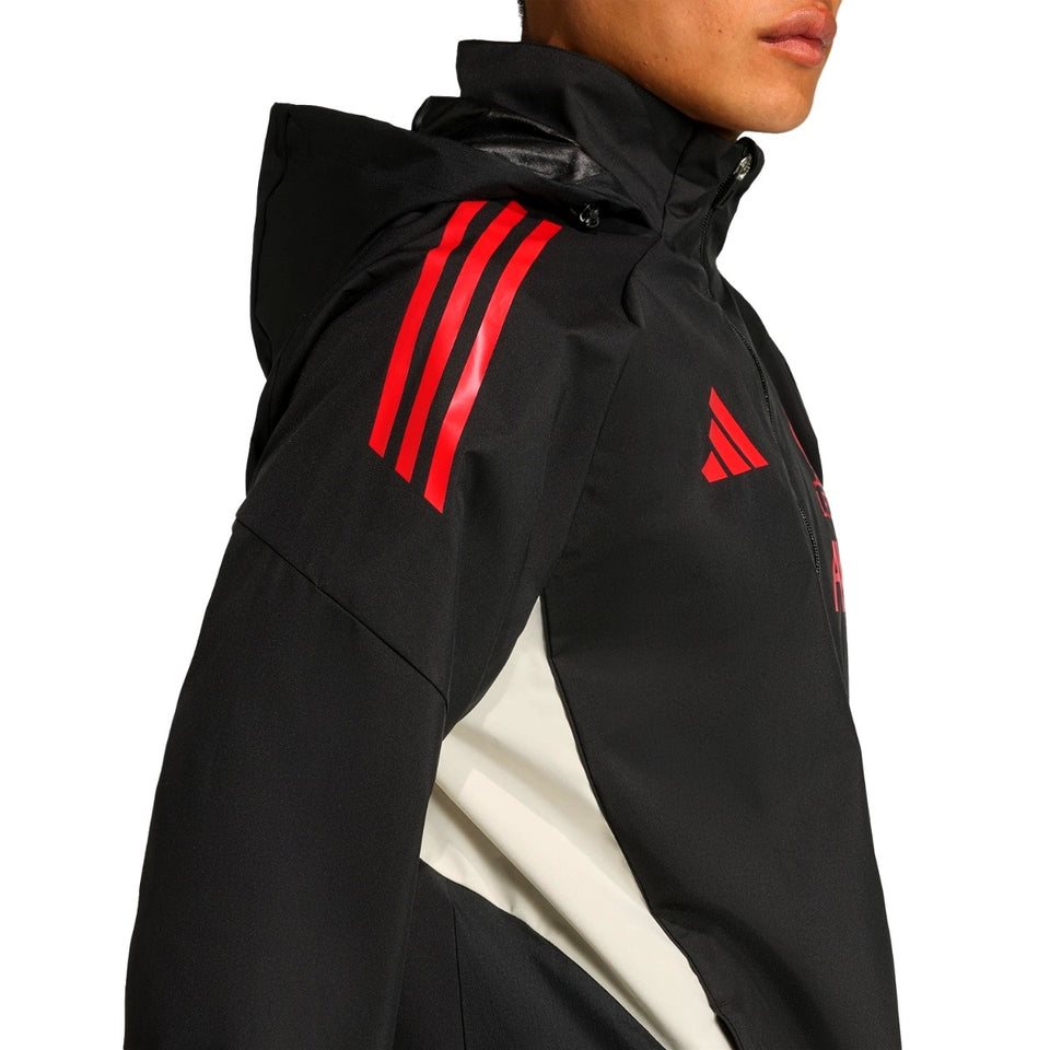 Liverpool FC black rain jacket 2025 on model hooded tracksuit top with red stripes and white side panels