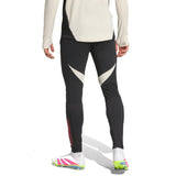 Back view of black and white Liverpool FC hooded training tracksuit pants with colorful cleats