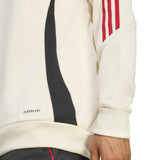 Close-up of Liverpool FC hooded training tracksuit sleeve with red stripes and Aeroready fabric technology