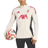Adidas Liverpool training soccer tracksuit top in white with red details worn by man holding soccer ball