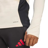Adidas Liverpool training soccer tracksuit close-up showing contrast colors and logo details on sleeve and pants
