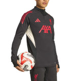 Adidas Liverpool training tracksuit 2025 black with red details and quarter zip top holding a soccer ball